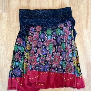 Super fun short circle skirt with tie at side.